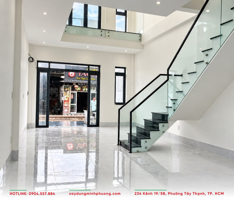 Bàn Giao Nhà Phố Gác Lửng Hiện Đại 5x17m Tại An Giang - BG25 5 Phòng khách nhà phố có gác lửng rộng rãi, thoáng đãng